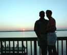 A couple at sunset on the beach.